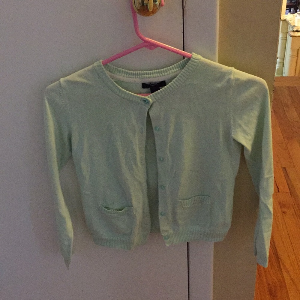 A mint colored soft cardigan.
